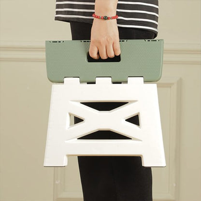 Tabouret pliable avec poignée pour le transport