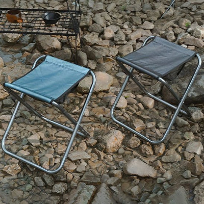 Tabouret pliable vert ou Noir en camping